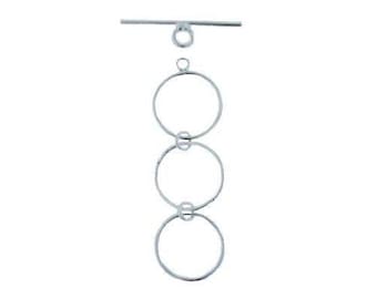 May include: Silver tone triple circle connector with a toggle clasp. The connector is made of three interlocking circles.