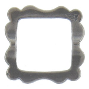 May include: Silver-toned metal frame with a wavy edge. The frame is square shaped and has a smooth finish.