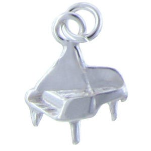 May include: A silver charm in the shape of a grand piano. The charm has a loop at the top for attaching to a bracelet or necklace.