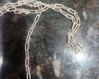 Sterling Silver 2x6 mm paper clip twisted wire, elongated. Chain. Price per: 1 Foot.