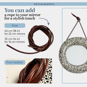 May include: A brown leather rope, coiled and ready to hang a mirror. The image shows a round mirror with a black and white speckled pattern. Text indicates rope sizes: 18 inches for 22 cm mirrors and 14 inches for 16 cm mirrors.