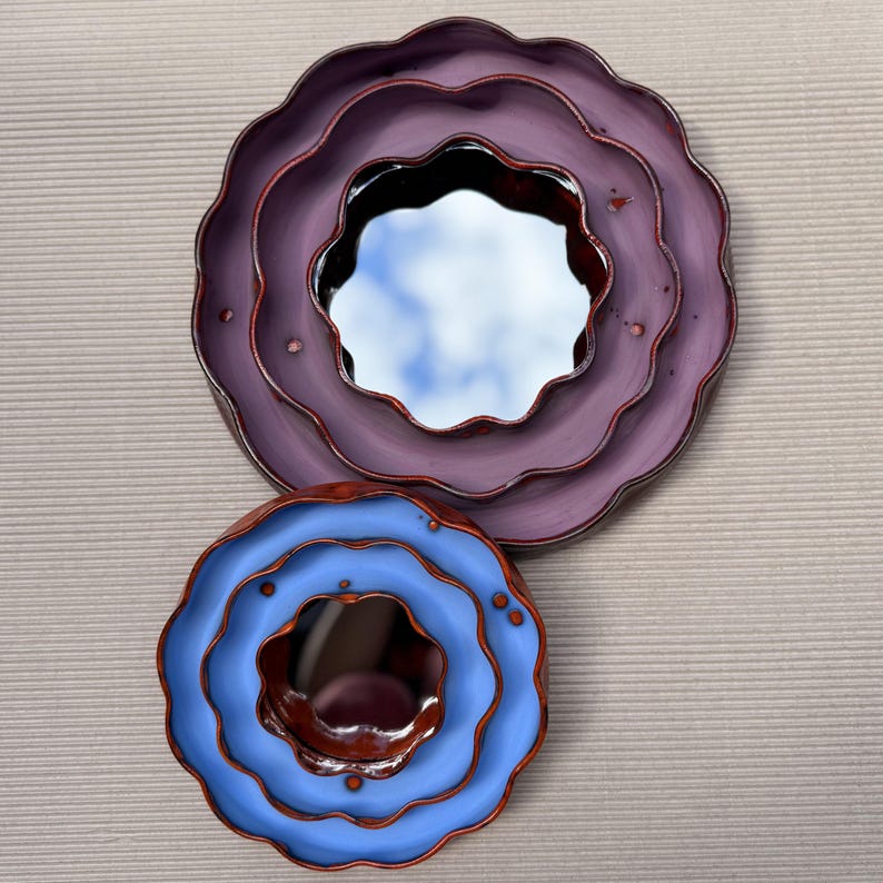 Handmade flower-shaped wall mirrors in purple and blue glazed ceramic frames, decorative scalloped mirror set, unique artistic home decor.