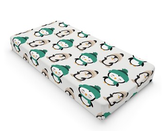 Simpatico copri fasciatoio per neonati con pinguino