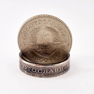 May include: A silver ring made from a Yugoslavian coin. The ring features the text "SRPSKA JUGOSLAVIJA" and a star design.