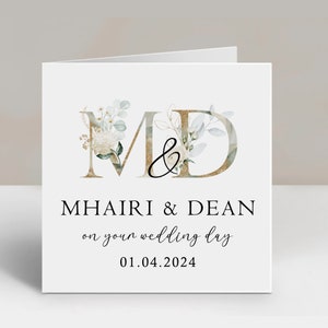 a wedding card with the letter m and d on it