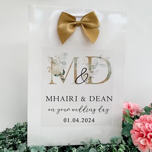 a sign with a bow on top of it