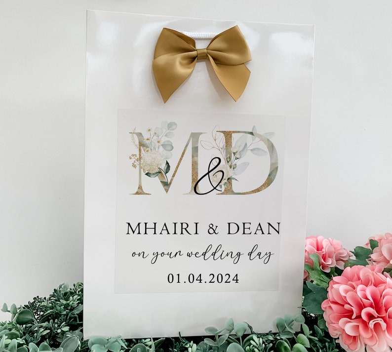 a sign with a bow on top of it