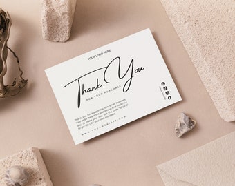 May include: White thank you card with black text that says "Thank You for your purchase". The card also includes a website address and social media icons.
