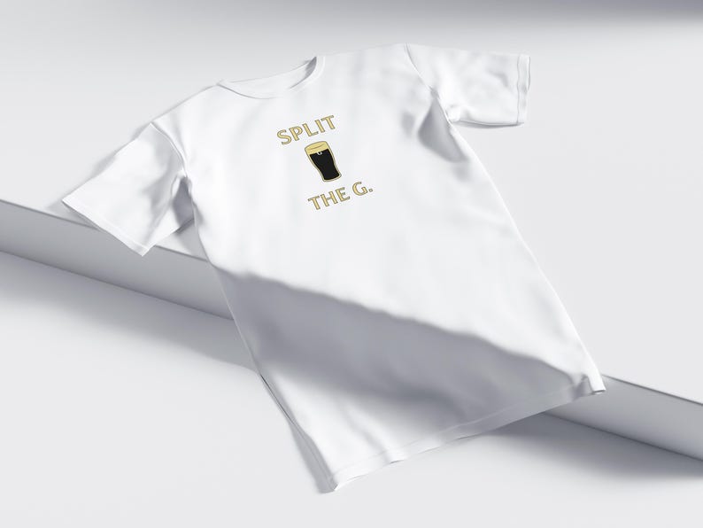 May include: White t-shirt with the text "SPLIT THE G." and a graphic of a pint of beer.