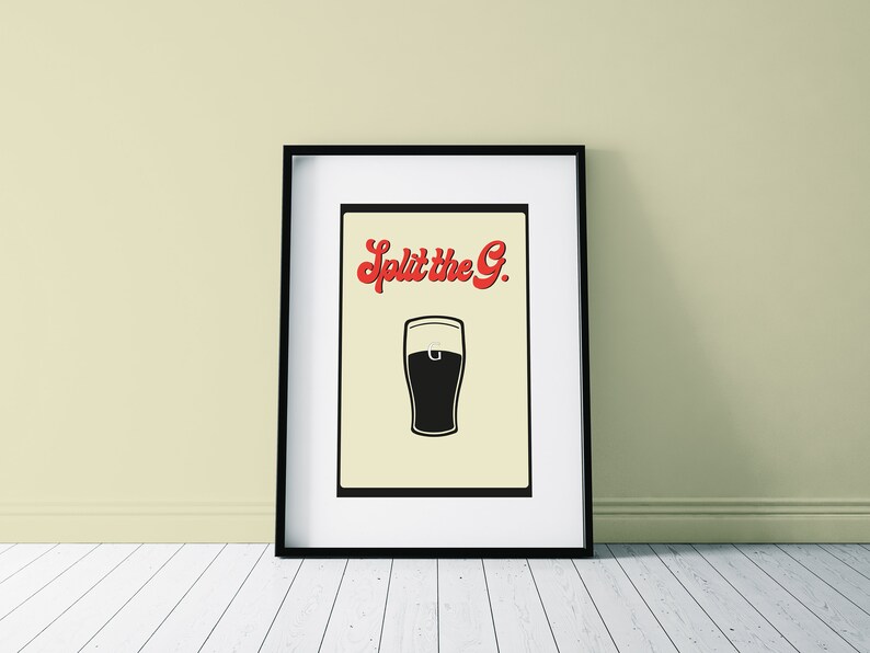 May include: Framed art print featuring a black and white illustration of a pint of beer. The text "Split the G." is in red script above the beer glass. The artwork is displayed in a black frame.