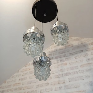 Magnificent seventies cascade chandelier with vintage glass globes