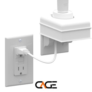 May include: White plastic outlet cover with a white electrical cord plugged into it. The cord is connected to a white plastic device with a round opening on top. The device is mounted on a wall.