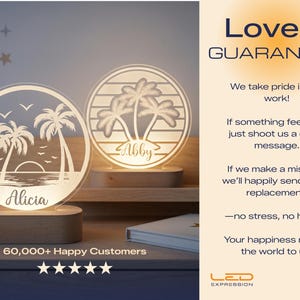 May include: Two illuminated, personalized LED night lights with a beach theme. One features the name "Alicia" and the other "Abby". Each light has a palm tree design and sits on a wooden base. The image also includes the text "Made in USA".