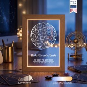 May include: A rectangular wooden frame containing a clear acrylic panel with an illuminated white star map graphic. The text reads Noah Alexander Brooks, THE NIGHT YOU WERE BORN, January 28, 1987, Riverside, CA. It features dimmable cool-warm white light.