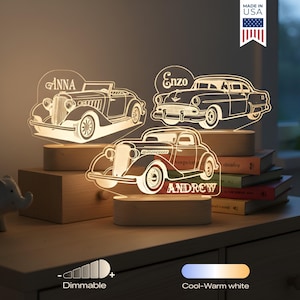 May include: Three illuminated car-shaped night lights with personalized names: Anna, Enzo, and Andrew. The lights are made of clear acrylic and sit on wooden bases. The image also shows a dimmable feature and a cool-warm white light option.