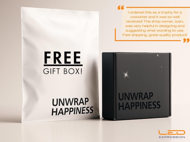 May include: A white gift bag and a black box. The bag reads "FREE GIFT BOX!" and "UNWRAP HAPPINESS" in black text. The box also says "UNWRAP HAPPINESS". The LED Expression logo is at the bottom.
