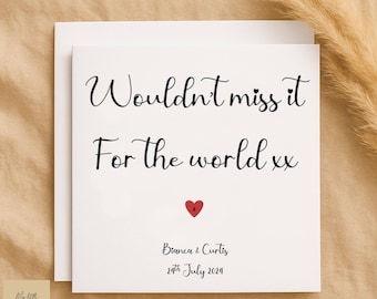 May include: A white greeting card with the text "Wouldn't miss it For the world xx" in black script. A red heart is centered below the text. The names "Bianca & Curtis" and the date "24th July 2024" are printed below the heart.
