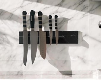 Magnetic knife rack made of real marble holds all knives