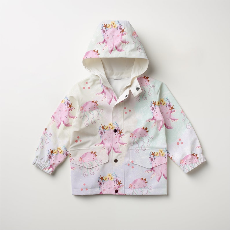 May include: A white hooded raincoat with a pink and purple octopus print. The octopus is wearing a flower crown and has a pink and purple body.