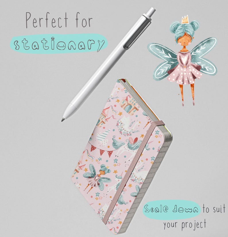 May include: A pink notebook with a whimsical pattern featuring fairies, unicorns, and castles. The notebook has a pink elastic band closure and a white pen is shown next to it.