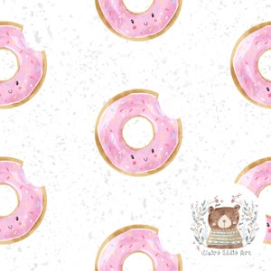 May include: A seamless pattern featuring pink and gold donuts with sprinkles and happy faces on a white background with a speckled texture. The pattern also includes a brown bear wearing a striped shirt in a floral wreath with the text "Claire Eddie Art".