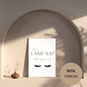 Puede incluir: Un cartel enmarcado con el texto "Free LASH NAP with every appointment" y un par de pestañas estilizadas. El cartel está en un marco dorado y está etiquetado como "DIGITAL DOWNLOAD". Un pequeño jarrón con una ramita de flores está en el estante.
