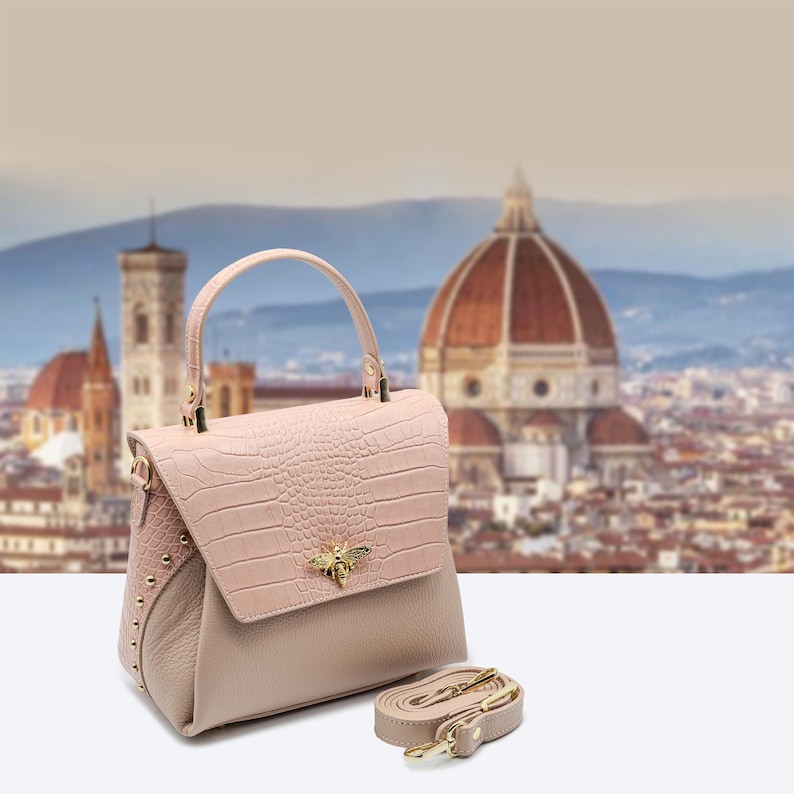 Italian Handmade Leather Bag – Elegant and timeless, crafted in Florence from premium leather with croc-embossed flap, gold bee emblem, and soft black lining. Perfect structured handbag for everyday chic or formal occasions. Includes shoulder strap. Made in Italy.