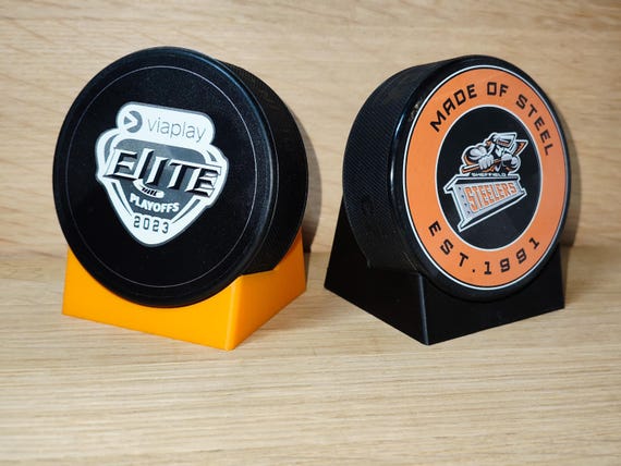 Hockey puck display stand