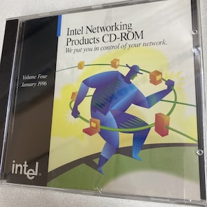 May include: A CD-ROM disc with a blue and yellow illustration of a person holding a network cable. The text on the disc reads "Intel Networking Products CD-ROM We put you in control of your network. Volume Four January 1996 intel"