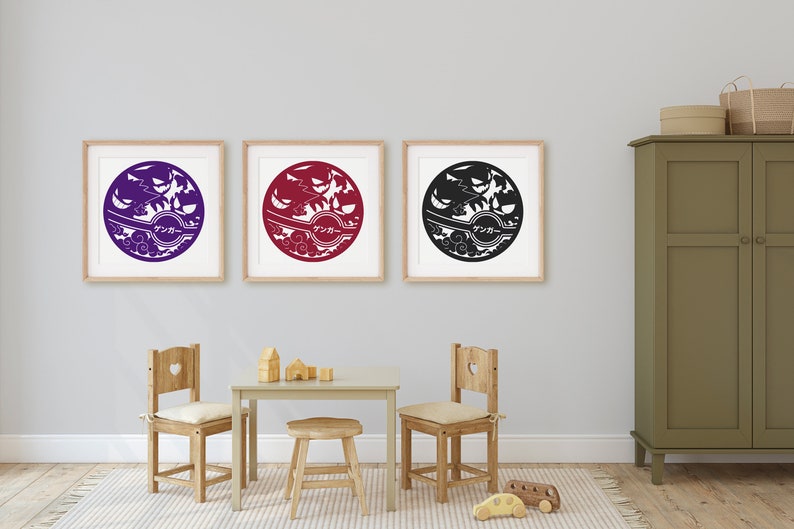 May include: Three framed prints of a stylized black and white design with a circle in the center. The circle contains a Japanese word and a stylized image of a tree and birds. The prints are hanging on a white wall above a wooden table and chairs.
