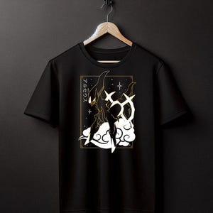 May include: Black t-shirt with a white graphic of a creature with wings and the Japanese text "アルセウス" on a gold background.