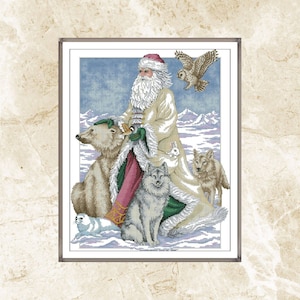 May include: Cross-stitch artwork depicting Santa Claus surrounded by arctic animals. Santa wears a white coat with green and red accents, a red hat, and a long white beard. Animals include a polar bear, wolf, owl, seal, and rabbit, set against a snowy landscape.