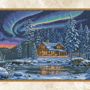 May include: Cross-stitch art of a winter cabin scene under the aurora borealis. The cabin is nestled among snow-covered pine trees, with a lake reflecting the lights. The sky transitions from purple to green.