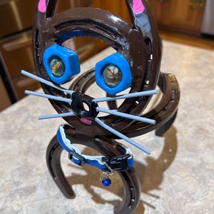 Brown Cat made with Horseshoes