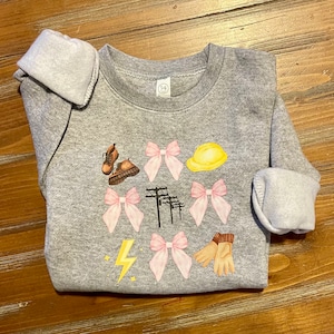 Power/lineman daughter Pink Stacked Lightning Bolt, Pink Ribbon Infant/Toddler/Kid DTF crewneck sweatshirt