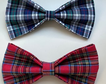 May include: Two plaid bow ties. One is blue, green, and white. The other is red, blue, and yellow.