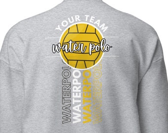 May include: Grey sweatshirt with a white and gold design. The design features a water polo ball and the text "YOUR TEAM water polo". The word "WATERPOLO" is repeated vertically down the side of the sweatshirt.