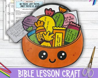 May include: A printable Halloween craft for kids featuring a pumpkin-shaped bowl filled with candy-shaped cards with Bible verses. The text on the cards includes "Jesus is the light of the world!" and "Jesus loves you!"