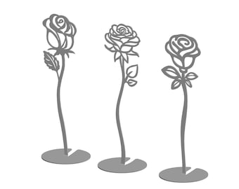 May include: Three grey metal rose flower sculptures with a simple design. Each rose is on a stem with leaves and a circular base.