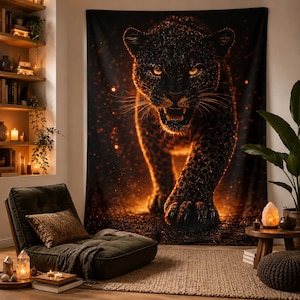 May include: A large rectangular wall tapestry featuring a high-contrast graphic of a black panther with glowing orange eyes and fur accents, set against a dark background with scattered golden light particles and a forward-facing predatory stance.