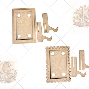 May include: Two unfinished wooden picture frames with stand-up supports. One frame is rectangular, the other has a scalloped edge. Both have four pre-drilled holes for mounting. The frames are made of light brown wood.