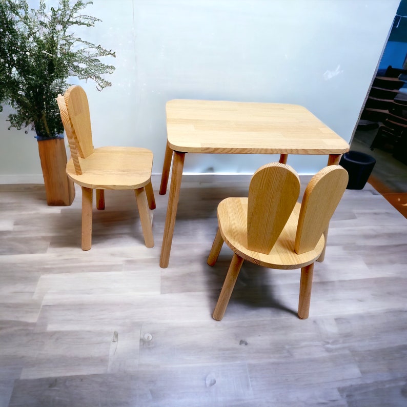 Kids table and chairs set is a part of montessori furniture to support childrens creativity . Activity table with chair is modern and minimalistic. Wooden kids table with two chair will enrich your kids room  touch to your kids furniture,