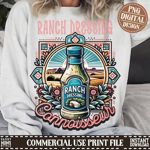 May include: A digital design featuring a bottle of ranch dressing with a vintage style illustration. The bottle is surrounded by flowers and a landscape scene. The text "RANCH DRESSING Connoisseur" is displayed on the design.