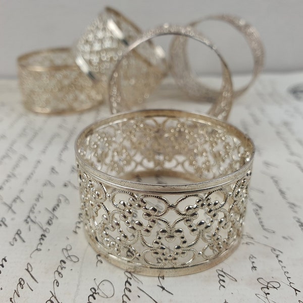 Pretty delicate silver-plated Napkin or Serviette Rings, Set of five/six.