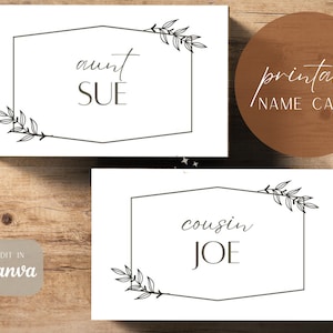 Peut inclure: Deux cartes de nom imprimables avec un cadre géométrique simple et des accents floraux. La carte du haut indique "tante SUE" et la carte du bas indique "cousin JOE".