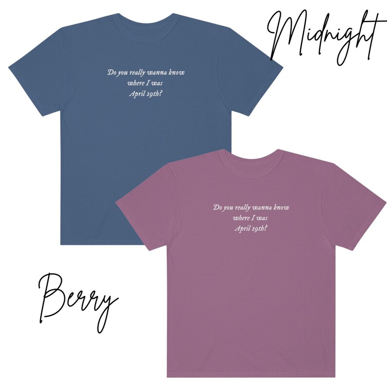 May include: Two t-shirts in different colors, one blue and one purple, with the same text printed on the front: "Do you really wanna know where I was April 29th?" The text is in white and the shirts are both crew neck.
