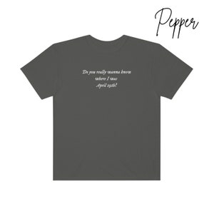 May include: A dark gray t-shirt with the text "Do you really wanna know where I was April 29th?" printed on the back.
