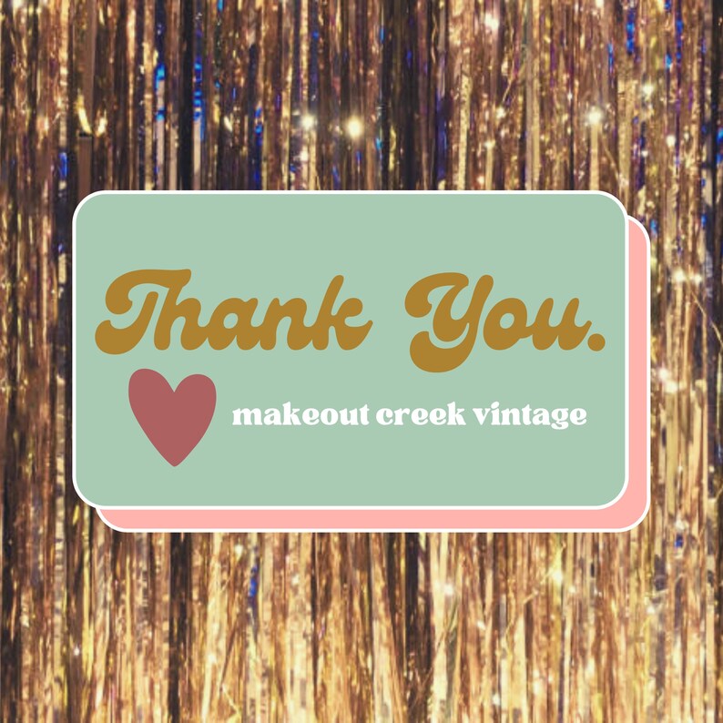 May include: A light green and pink thank you card with a brown heart and the text "Thank You. makeout creek vintage" in a retro font.