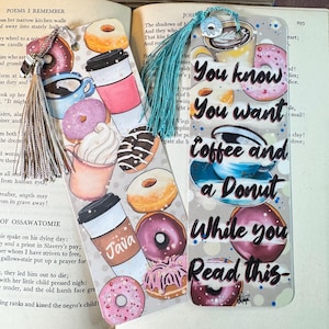 May include: Two colorful bookmarks with a coffee and donut theme. The bookmarks feature a variety of donuts, coffee cups, and the text "You know you want coffee and a donut while you read this".