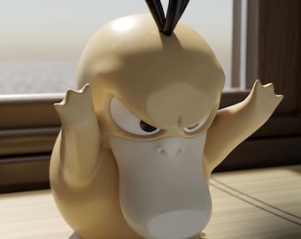 May include: A yellow, smooth-surfaced figurine of a duck-like creature with a large white beak, narrow eyes, and three black hair-like protrusions on its head. The figure has raised arms and is positioned near a window. A logo reads MAPLE 3D PRINTING.